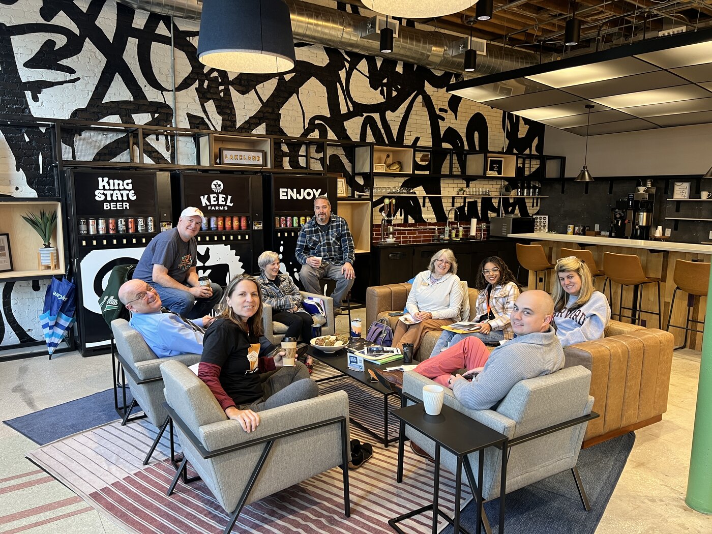 A group gathered around the lounge seating at COhatch Lakeland